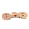 zapiecie dekoracyjne metalowe haftka do odziezy 10x27mm zlote do swetrow bluzek